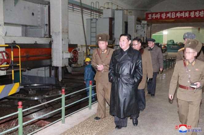 This undated photo, provided on January 28, 2022 by the official KCNA agency, shows Kim Jong-un visiting an ammunition factory, at an unspecified location.