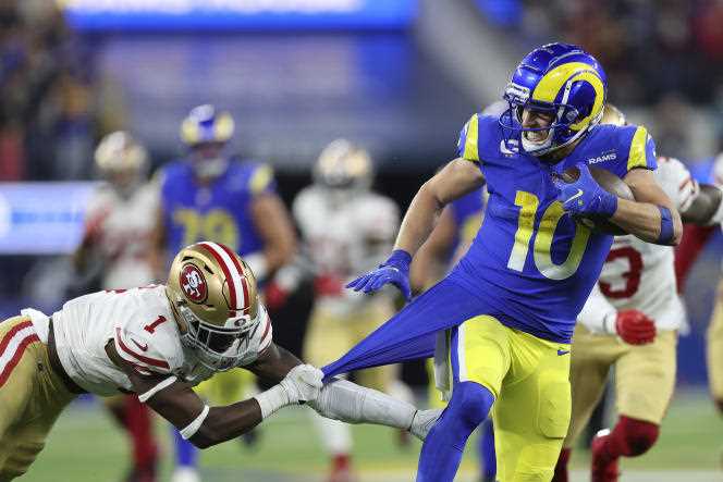 Los Angeles Rams wide receiver Cooper Kupp escapes against the San Francisco 49ers, January 30, 2002, in Los Angeles.