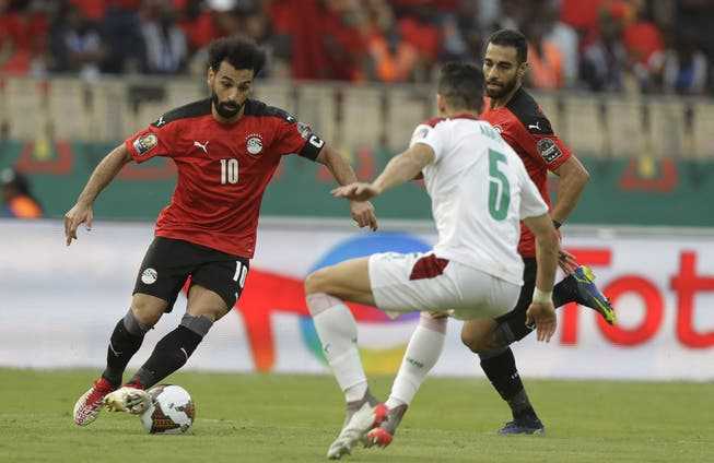 Mohamed Salah (left) leads Egypt to victory over Morocco with a goal and an assist.