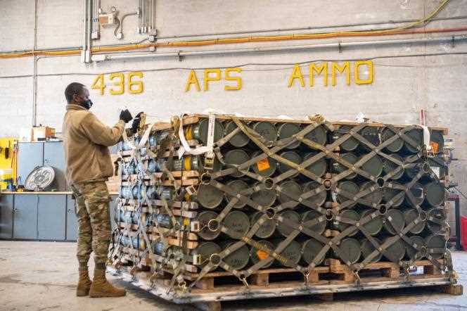 Airmen and civilians from the 436th Aerial Port Squadron organize ammunition, weapons and other equipment bound for Ukraine during a military overseas mission at Dover Air Force Base, Delaware, Jan. 21 2022. Photo courtesy of the US Air Force.