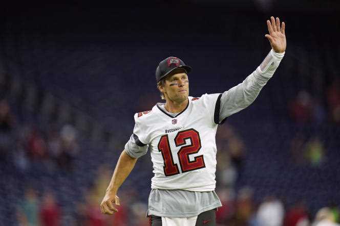 Quarterback Tom Brady waves to the crowd during an American football game in Houston, Texas, on August 28, 2021.
