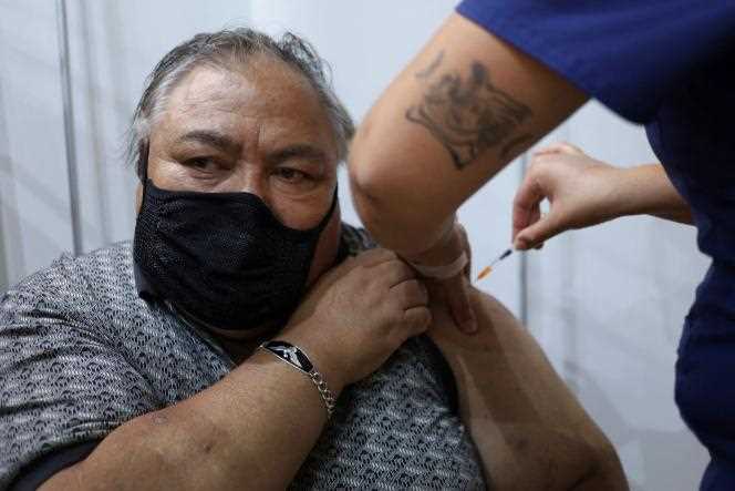A man receives his fourth dose of the Covid-19 vaccine in Santiago on January 11, 2022, as the campaign began the day before in Chile.