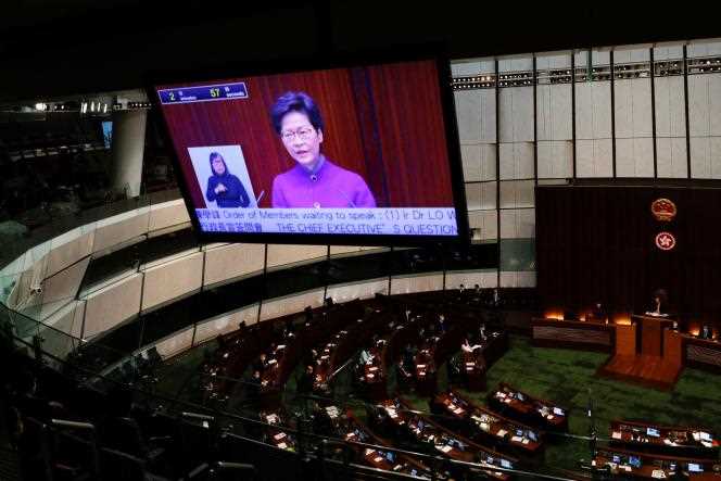 Chief Executive Carrie Lam responds to questions from lawmakers during the Legislative Council's first session in Hong Kong on January 12, 2022.