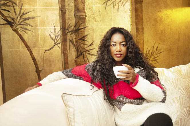 Hapsatou Sy drinks hot chocolate at the Hotel Elysia, in Paris, on December 16, 2021.