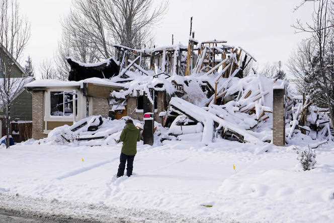 Snow covers the burnt remains of a house after the Marshall Fire in Louisville, Colorado, USA, Jan. 1, 2022.