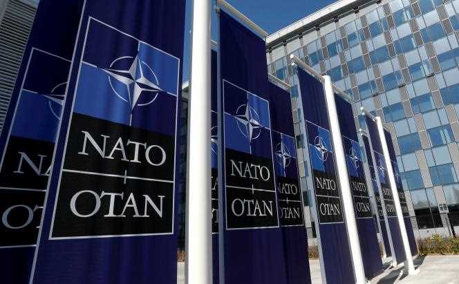 Banners displaying the NATO logo are placed at the entrance to NATO Headquarters when it relocates to Brussels, Belgium, April 19, 2018.