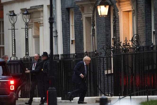 Britain's Prime Minister Boris Johnson returns to Downing Street in London on January 25, 2022.
