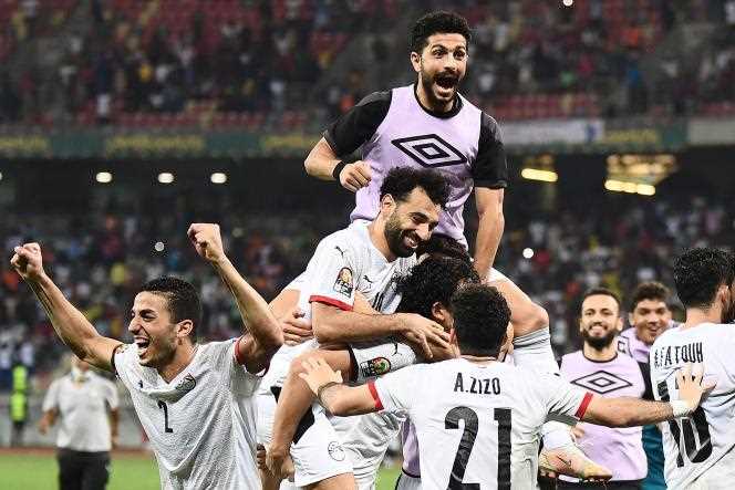 Egyptian striker Mohamed Salah and his teammates celebrate Egypt's victory over Ivory Coast in the round of 16 of the Africa Cup of Nations, at the Japoma stadium in Douala, Cameroon, January 26, 2022 .