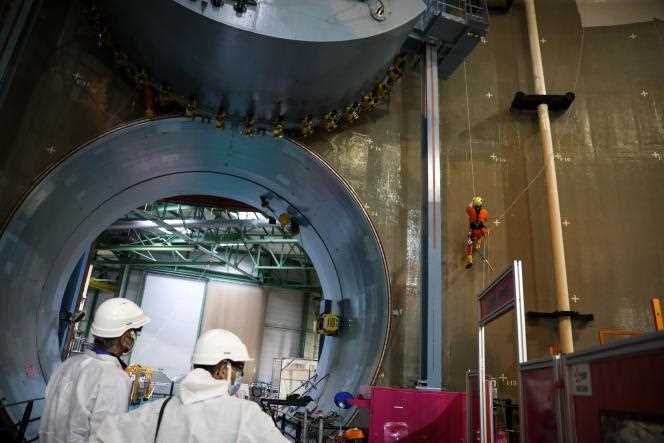 A rope access technician performs scouting on the walls of the reactor at the Civaux nuclear power plant, in Vienne, on September 8, 2021.