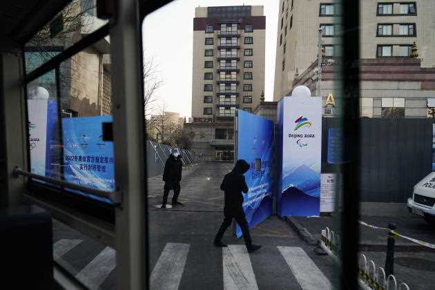 A guard opens the gates so that buses carrying Games participants can enter the compound of a hotel in Beijing on January 29.  This device is set up in front of each establishment of the 