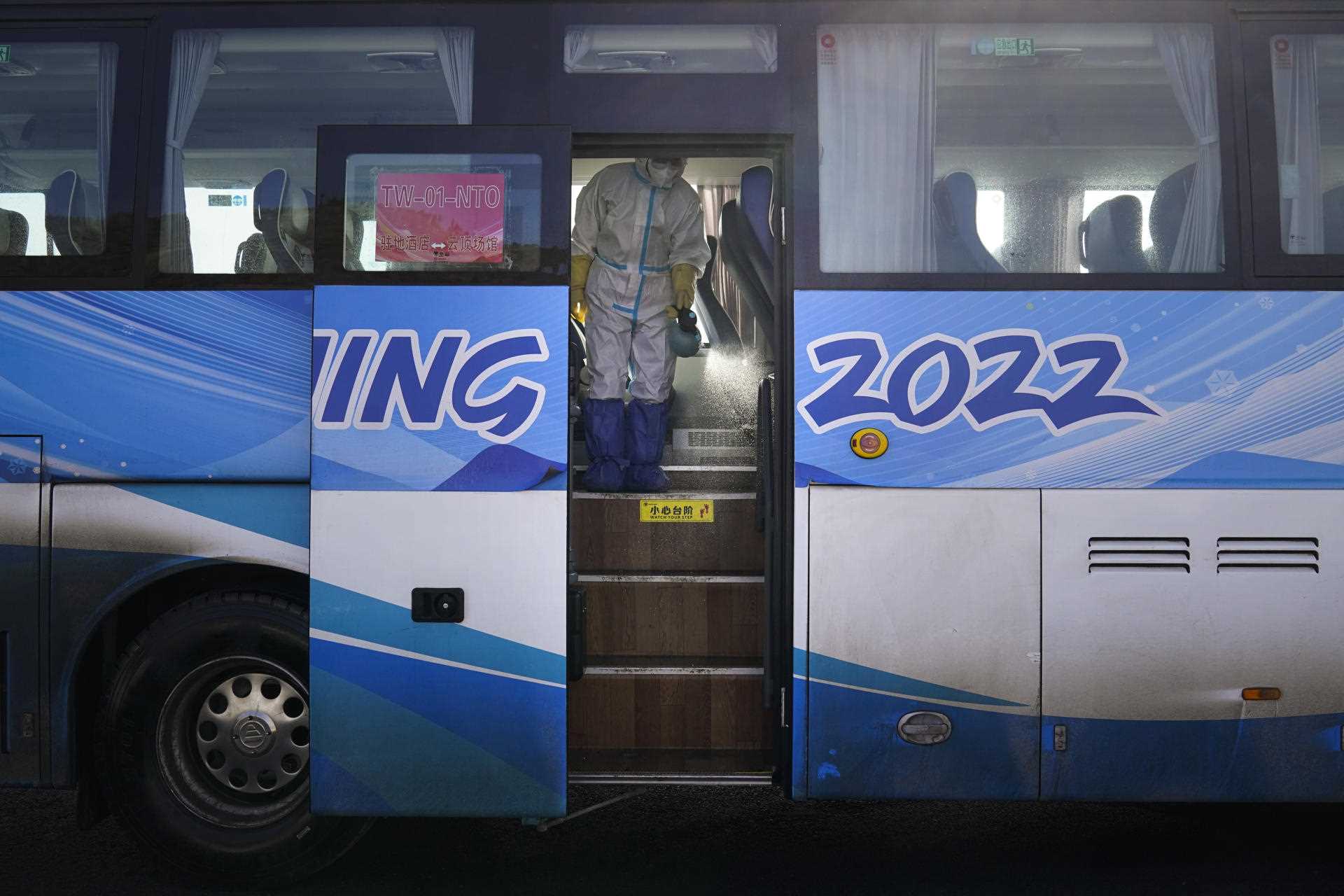 An employee disinfects one of the buses transporting participants to the Winter Olympics in Zhangjiakou on January 30.