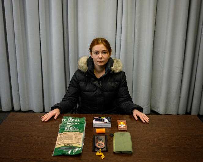 Olexandra Tsekhanovska, 30, an information security expert with part of her emergency kit in case of a Russian attack, in Kiev on February 2, 2022.