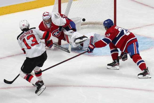 Nico Hischier (left) scores his tenth goal of the season against the Canadiens. 
