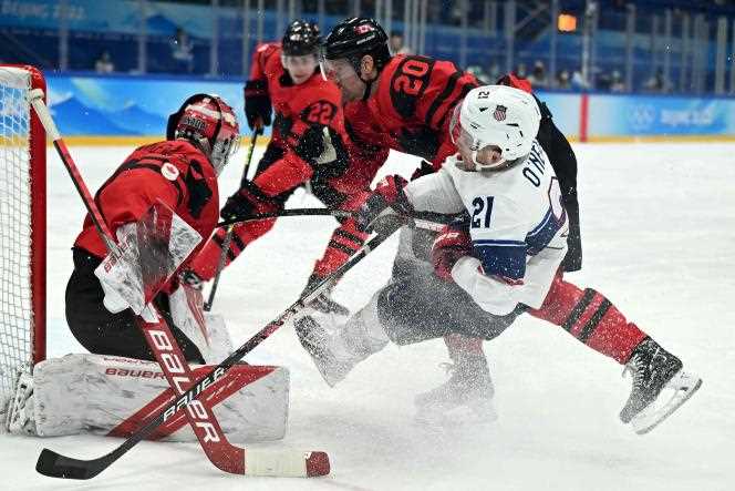 Canadian Alex Grant and American Brian O'Neill collide in the USA-Canada ice hockey match, won 4-2 by the United States in the group stage of the Beijing 2022 Games, on February 12 2022.