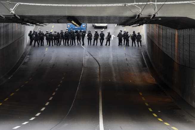 Police officers secure a tunnel in Zurich because of the unauthorized demonstration on Saturday. 