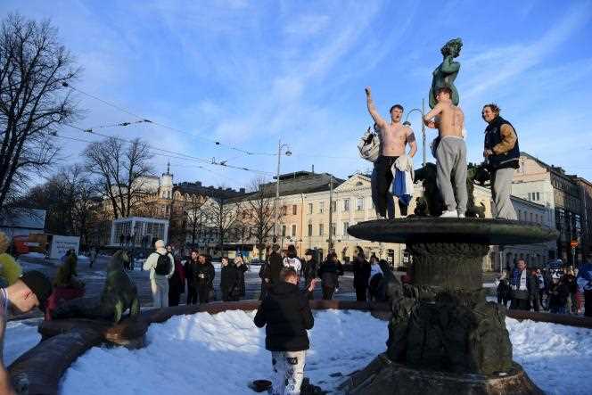In the streets of Helsinki, Finns celebrate their national team's Olympic title in ice hockey at the Beijing Olympics on February 20, 2022.