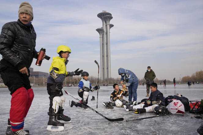 Young hockey players under the Olympic Towers in Beijing (China), January 18, 2022.