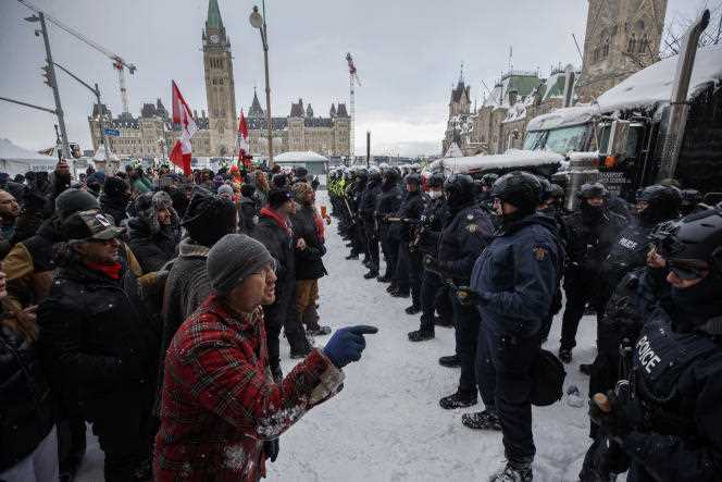 Face to face between police and protesters in Ottawa, Canada, February 19, 2022.