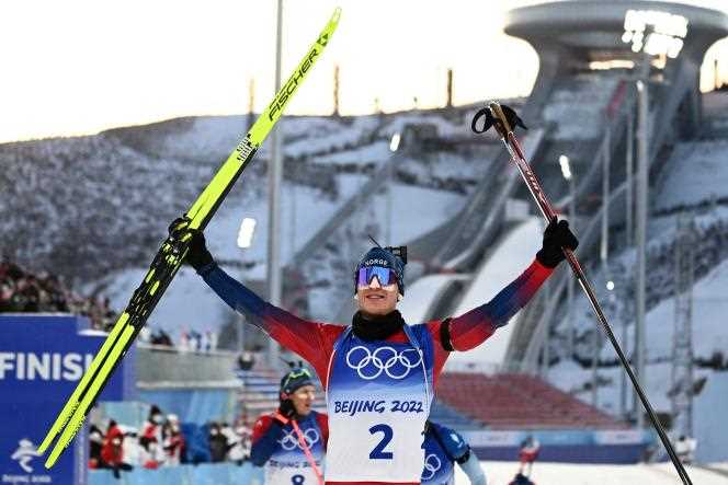 Norwegian Johannes Boe celebrates his victory during the biathlon mass start at the Beijing Olympics, in Zhangjiakou (China), February 18, 2022.