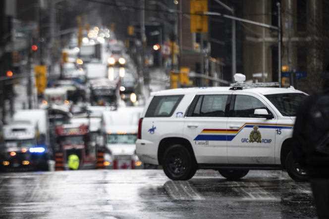 A police vehicle drives past a blockage near the Canadian Parliament, February 17, in Ottawa.