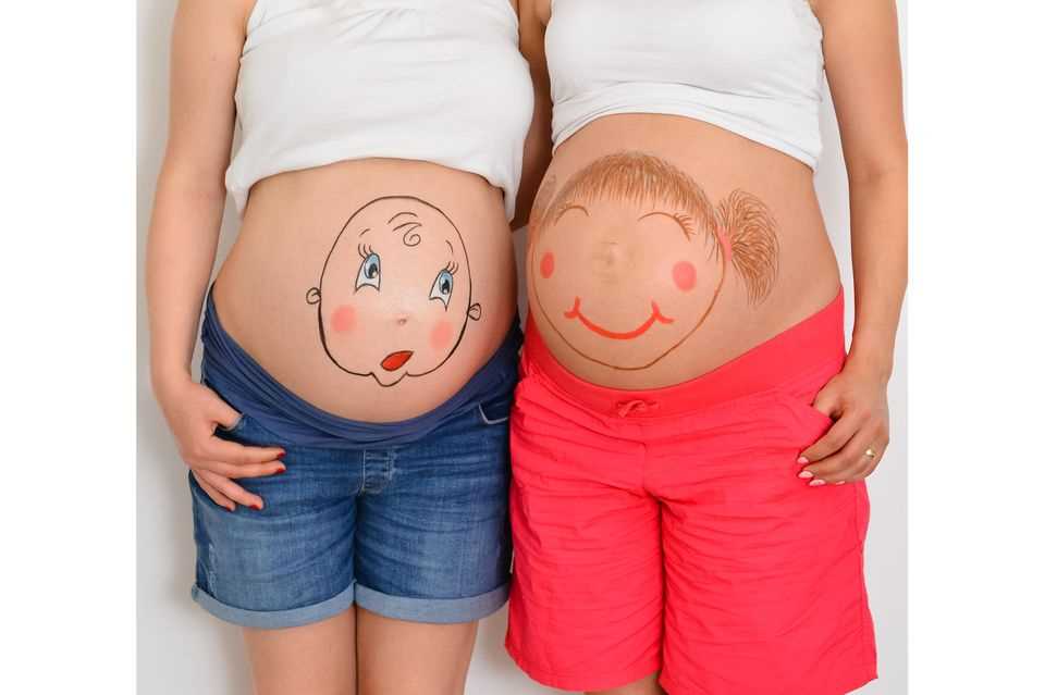 Paint baby bump: baby bump with boys and girls heads