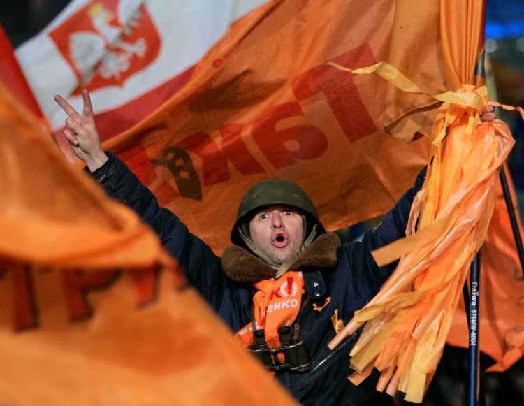 A supporter of Ukrainian opposition leader Viktor Yushchenko in Kyiv.  His election as president was preceded by the so-called Orange Revolution – the movement against electoral fraud.  December 27, 2004.
