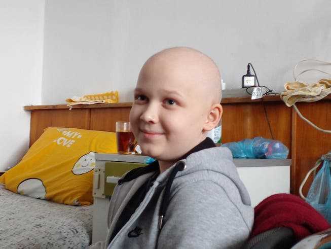 Anton is thirteen and has a brain tumor.  He loves his carers and likes to sing the Ukrainian national anthem in the air raid shelter. 