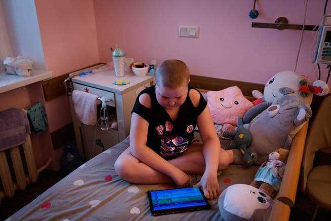 A child sits in a room in the children's hospital in Lviv.