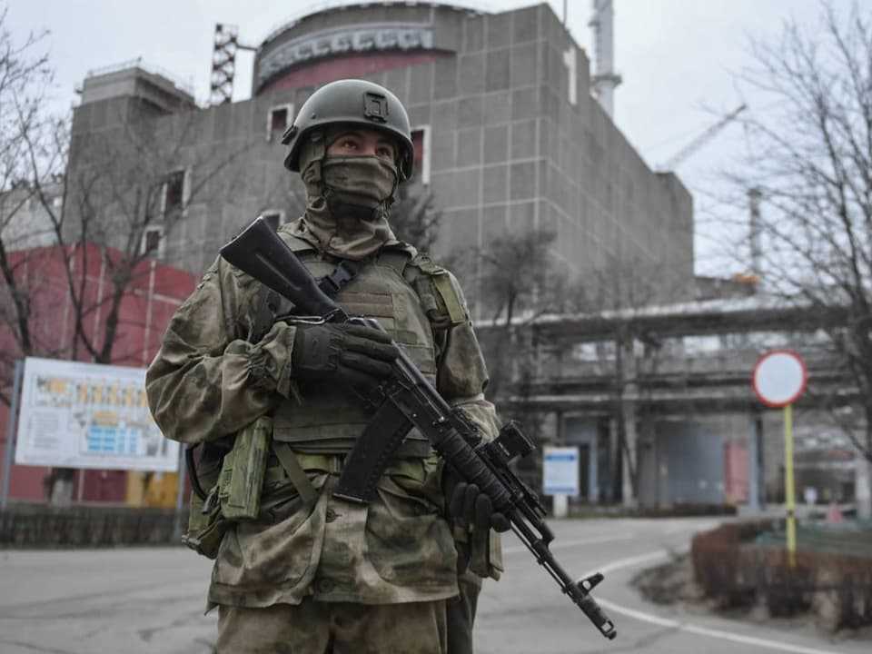 A Russian soldier guards the nuclear power plant near Zaporizhia.