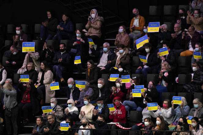 Signs of support for Ukraine in the stands of the Sud de France Arena during the World Figure Skating Championships on March 25. 