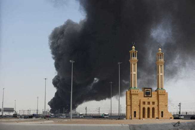 A plume of smoke rises in Jidda after an attack on an Aramco fuel depot.
