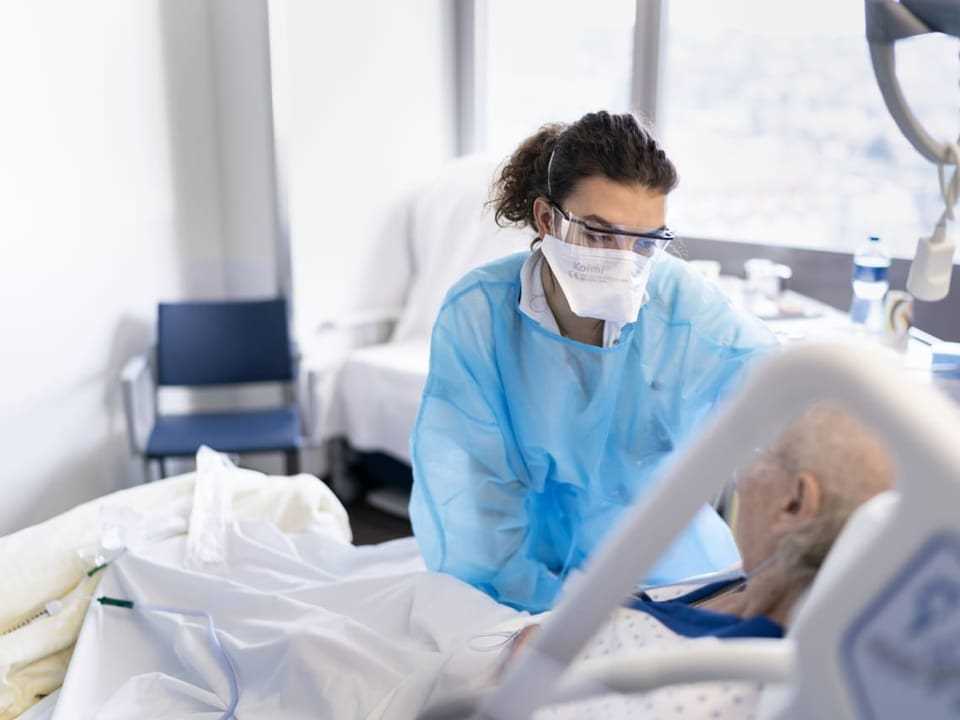 Nurse in the hospital treats a patient