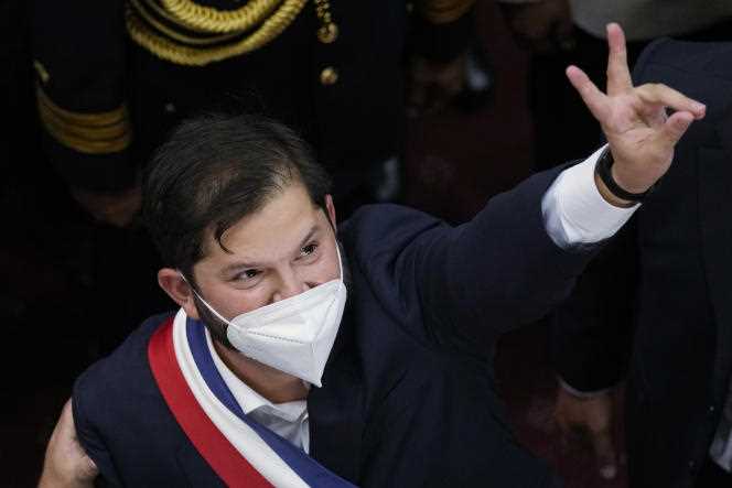 The new Chilean president, Gabriel Boric, makes the sign of victory after his investiture ceremony in Parliament, in Valparaiso, Friday March 11, 2022.
