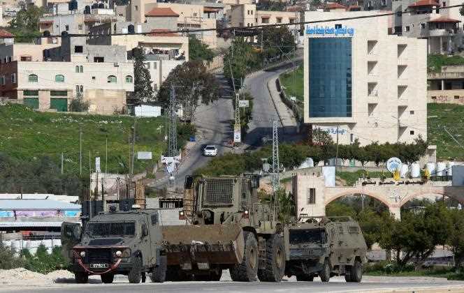 Israeli soldiers patrol on March 30, 2022 in a village south of Jenin in the occupied West Bank, where Palestinian assailant Diaa Hamarshah is believed to have departed before killing five people in a gun attack in Israel.