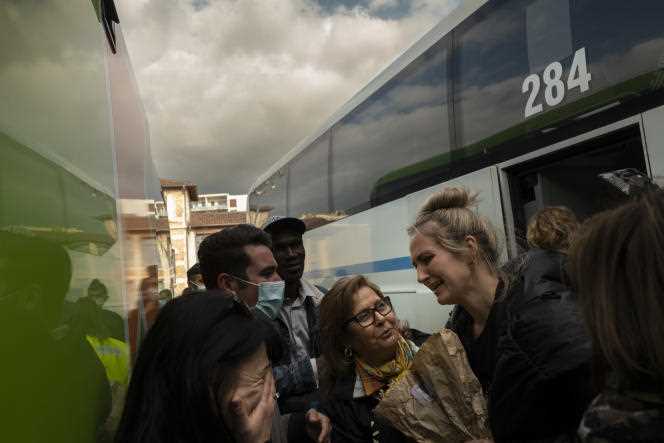 Refugees get off a bus arriving from Ukraine at the Marseille bus station on March 3, 2022.