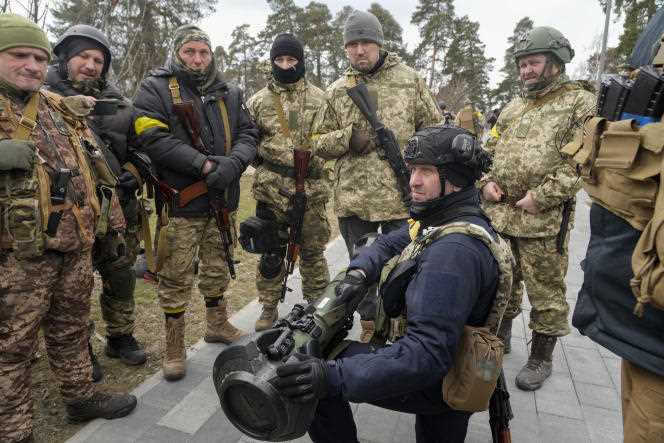 Members of Ukraine's Territorial Defense Forces practice using an NLAW anti-tank weapon in the outskirts of Kiev on March 9, 2022.