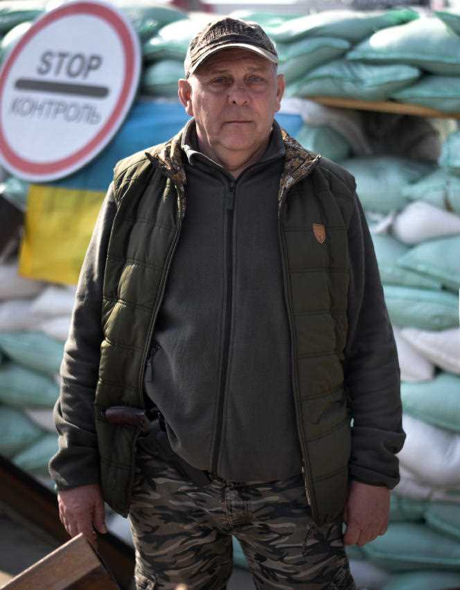 Andriy, a civilian standing guard, at a checkpoint in eastern Lviv, Ukraine, March 15, 2022.