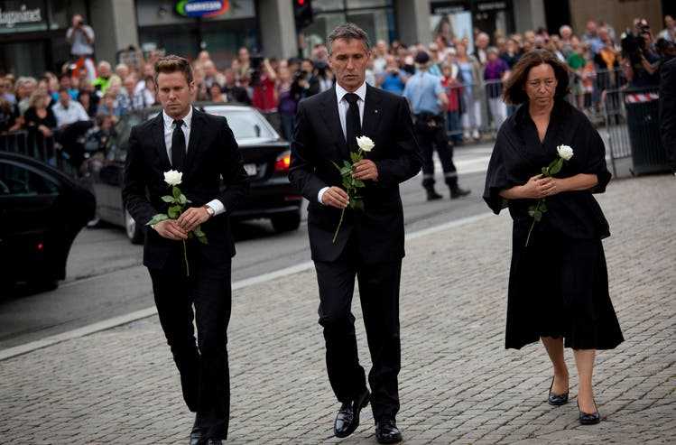 Stoltenberg (centre) with his wife Ingrid Schulerud before the funeral service at Oslo Cathedral after the massacre of youths during a summer camp in 2011.