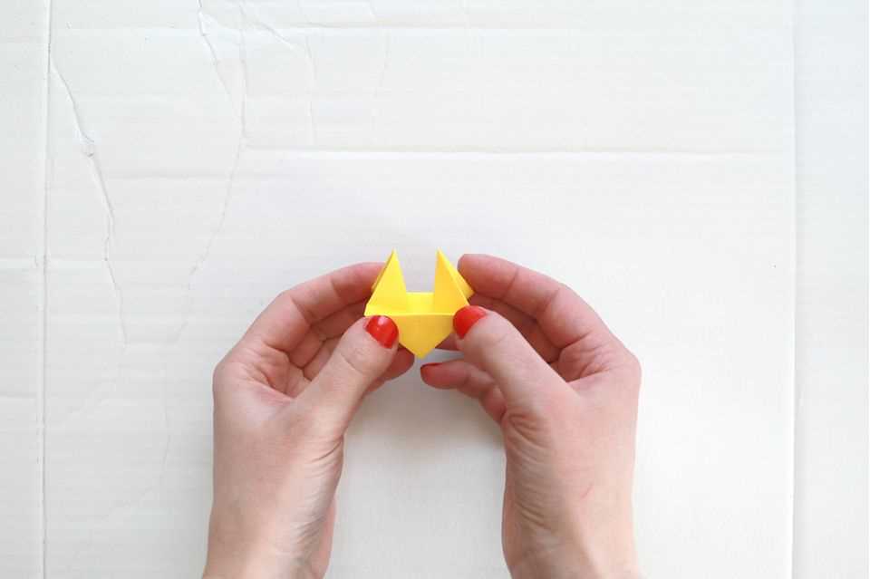 Origami animals: fold chicken Step 8