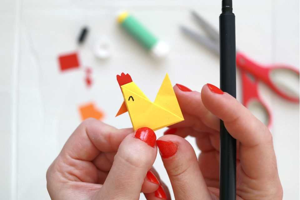 Origami animals: fold chicken step 11