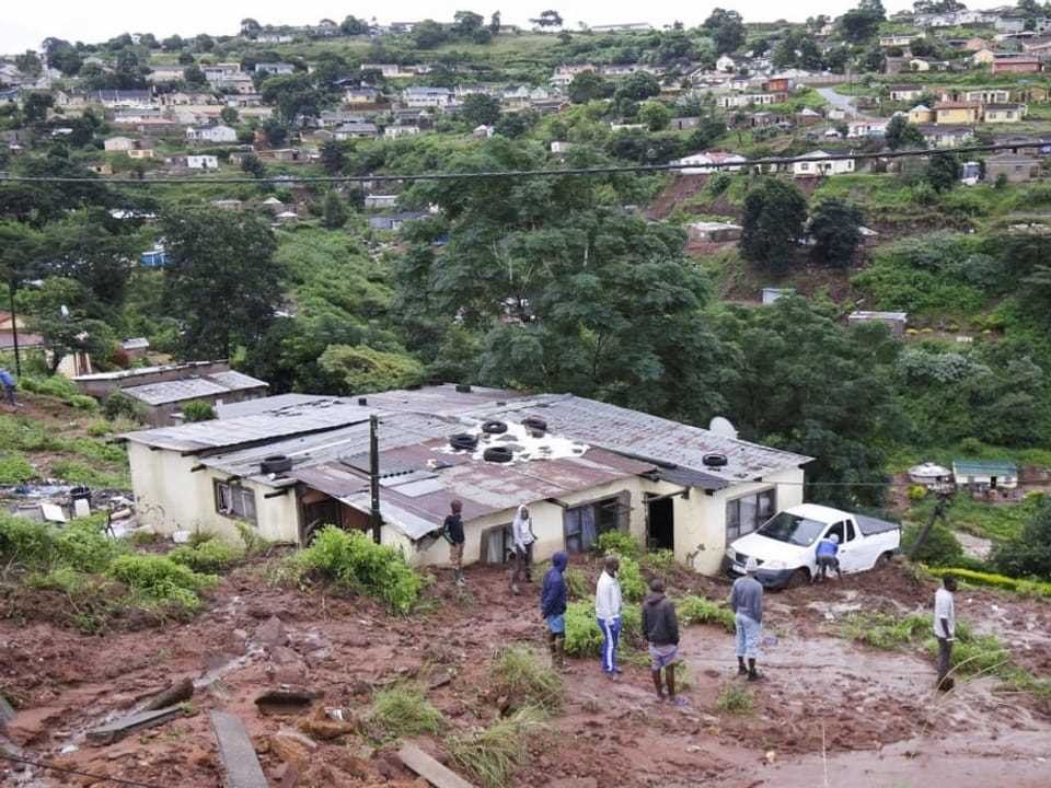 People in a landslide affected area.