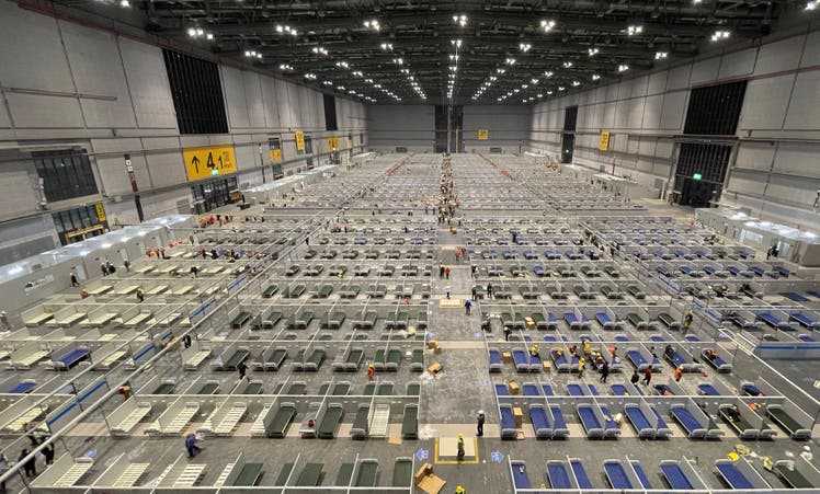 Workers convert an exhibition hall into Shanghai's largest makeshift hospital on April 9.