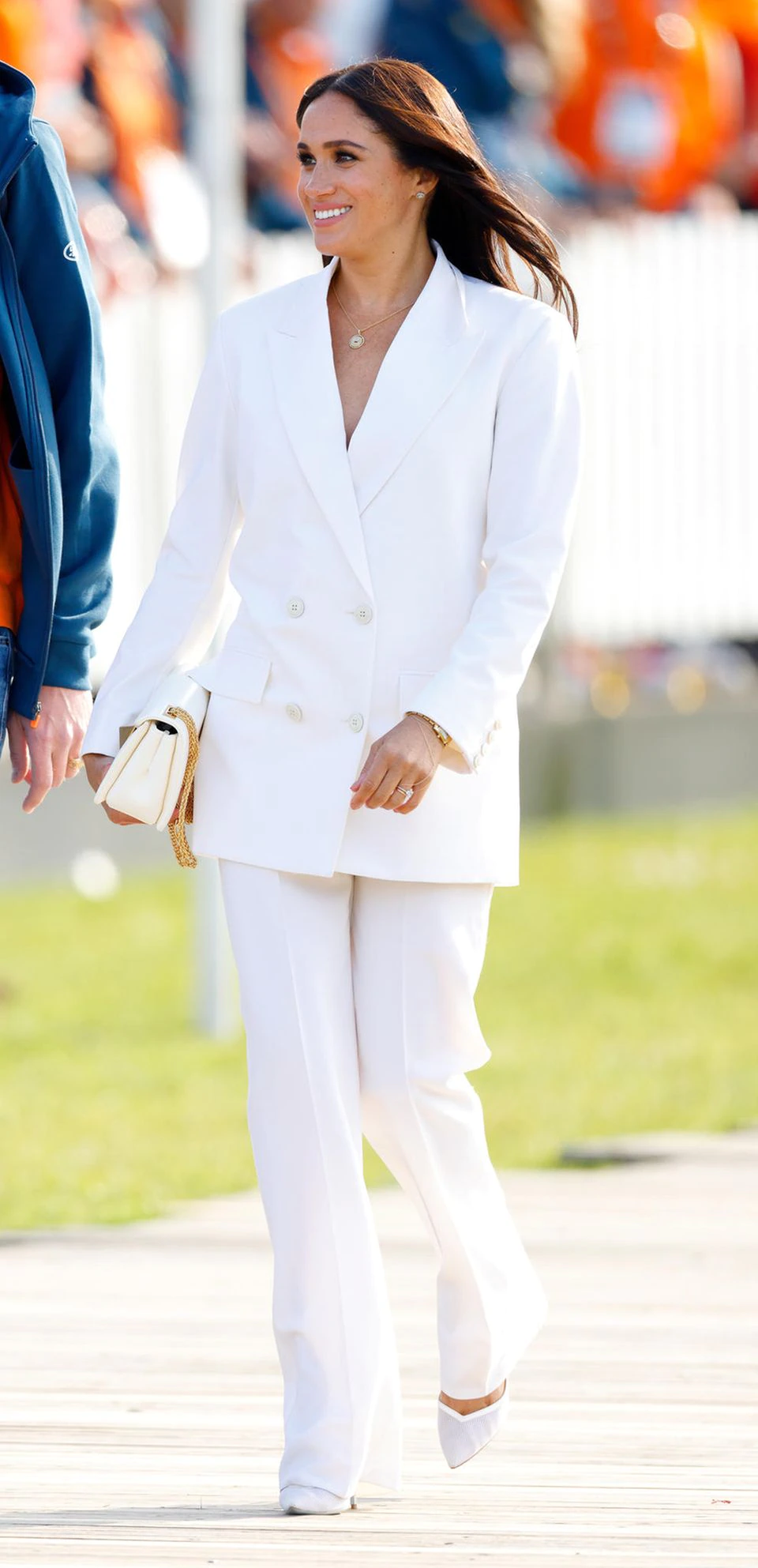 Meghan in a white Valentino suit