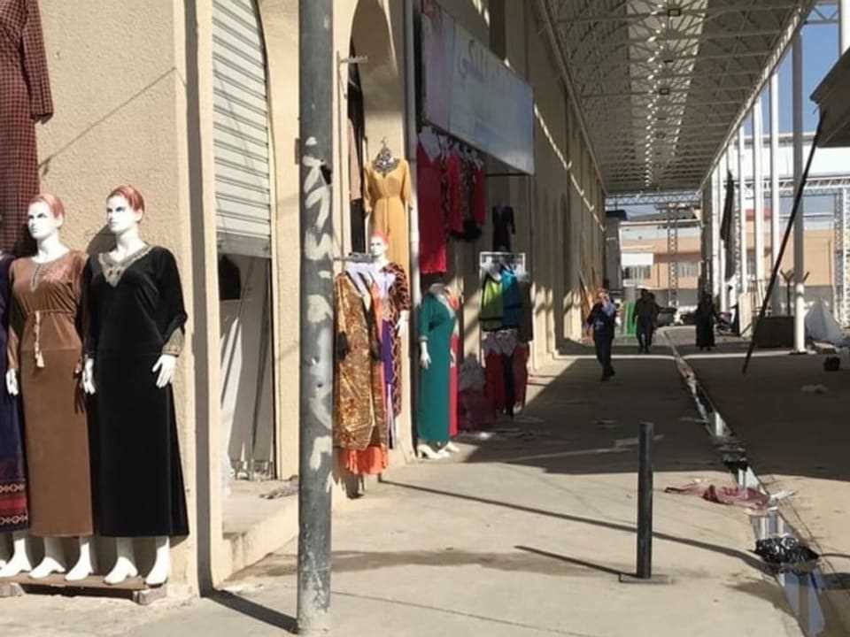 Row of shops in Mosul with mannequins