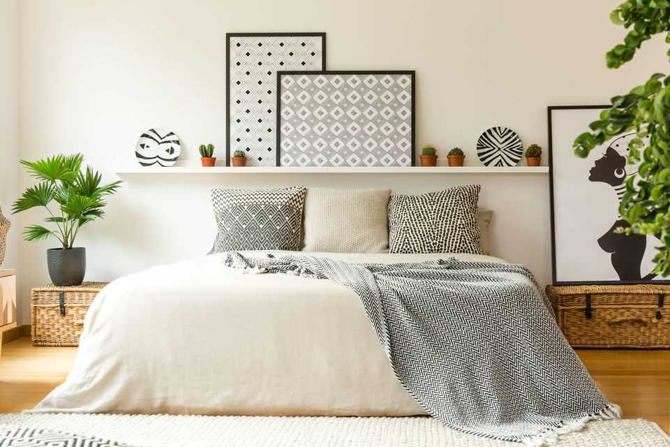 Make the bedroom more comfortable: Framed pictures above and next to the bed