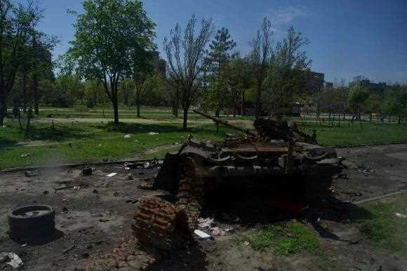 The wreckage of a tank in the streets of the city of Mariupol, April 29, 2022.