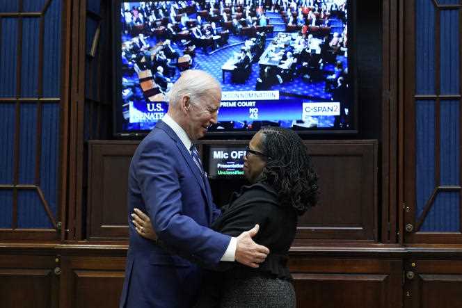 President Joe Biden and Justice Ketanji Brown Jackson watch the Senate vote on her confirmation at the Supreme Court in Washington on April 7, 2022. 