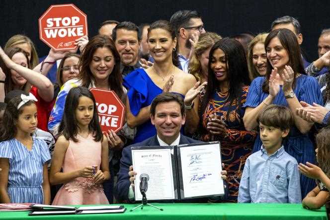 Florida Governor Ron DeSantis signs HB7, dubbed the “stop woke” law, as well as the Disney World Special Status Act, during a press conference at the private Mater Academy Middle and High School in Hialeah Gardens, Florida , April 22, 2022.