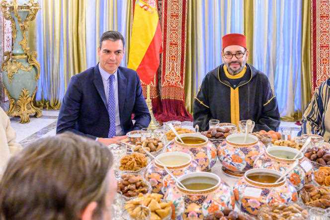In this photo provided by the Moroccan Royal Palace, King Mohammed VI (right) and Spanish Prime Minister Pedro Sanchez pose before an iftar meal, at the Royal King's residence in Salé, Morocco, April 7, 2022.