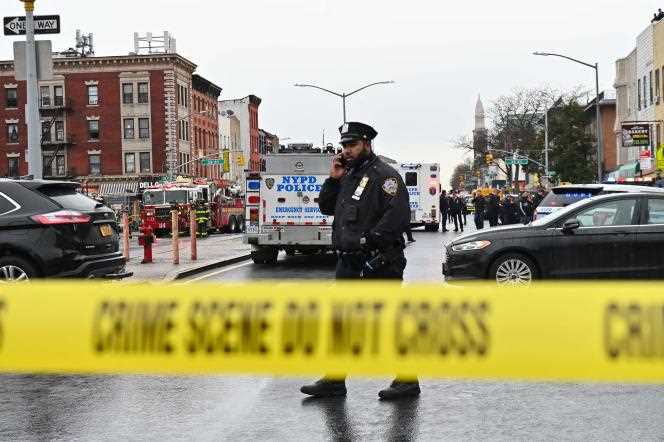 Police near the scene of the attacks at a subway station in the Brooklyn borough of New York on April 12, 2022. 